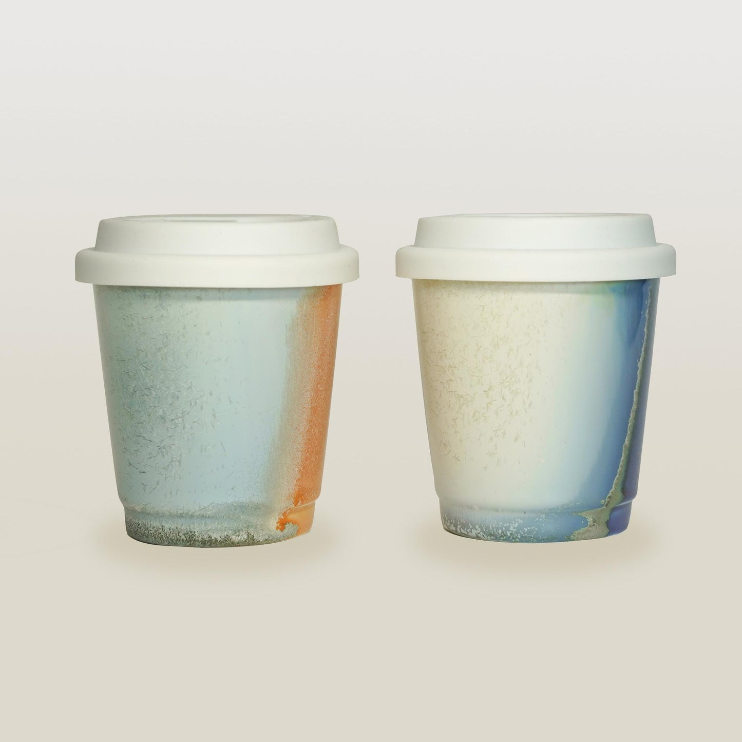purple orange comparison reusable to-go mug with white lid - smoothies. Ergonomic grip, eco-friendly