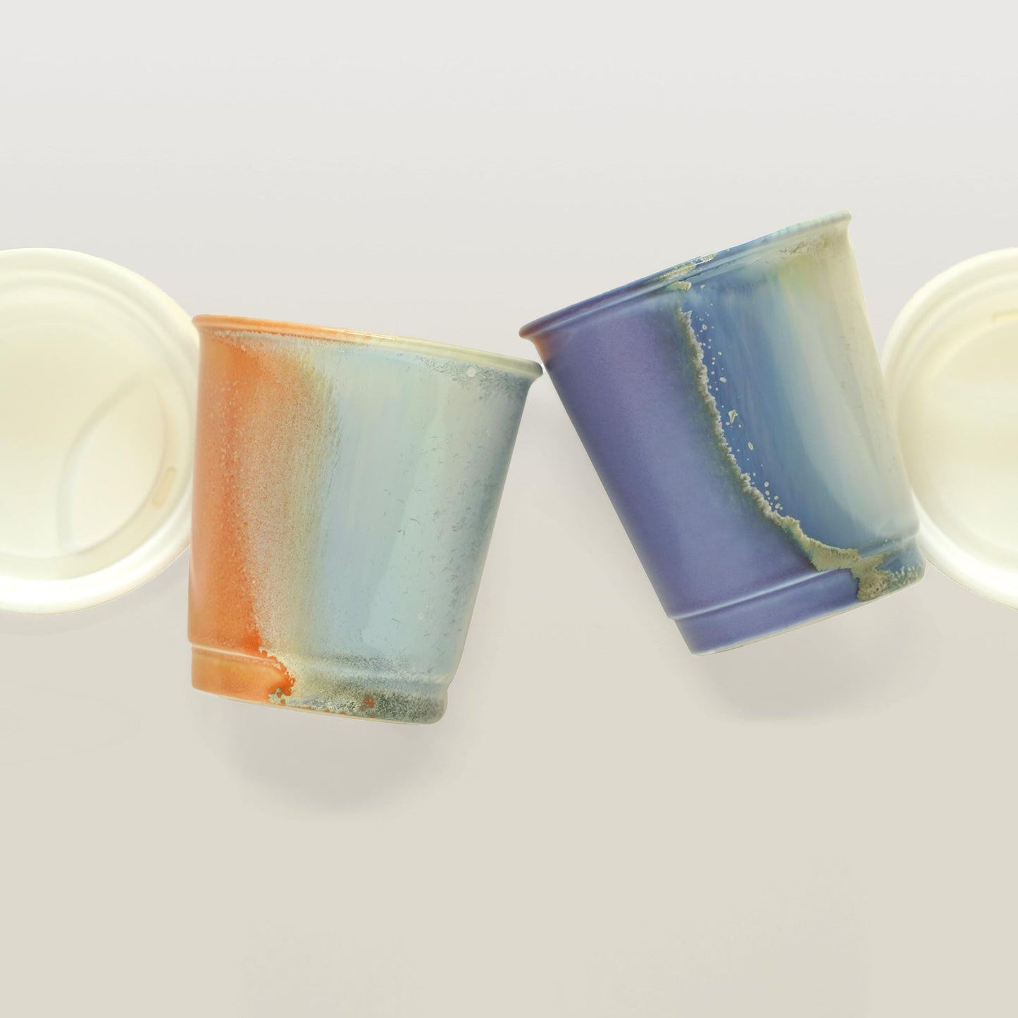 the glaze of purple orange comparison reusable to-go mug with white lid - smoothies. Ergonomic grip, eco-friendly stoneware.