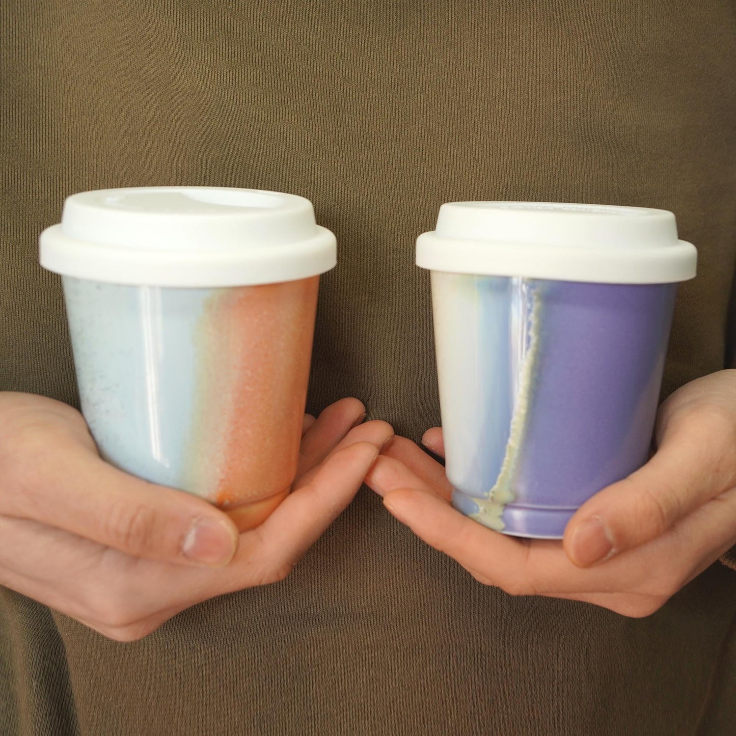 handhold purple orange comparison reusable to-go mug with white lid - Extra size for smoothies. Ergonomic grip, eco-friendly stoneware.