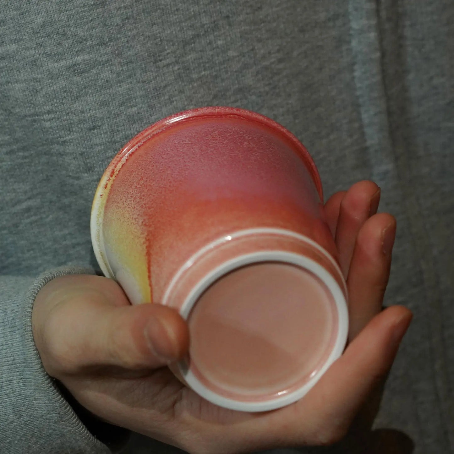 Close-up of red glaze and silicone lid seal on 9oz ruby red mug - Leak-proof technology for bumpy roads
