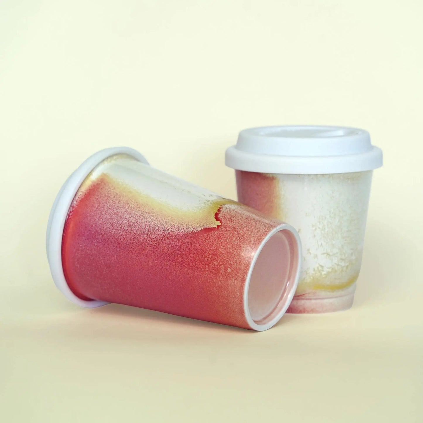 Close-up of red glaze and silicone lid seal on 11oz ruby red mug - Leak-proof technology for bumpy roads