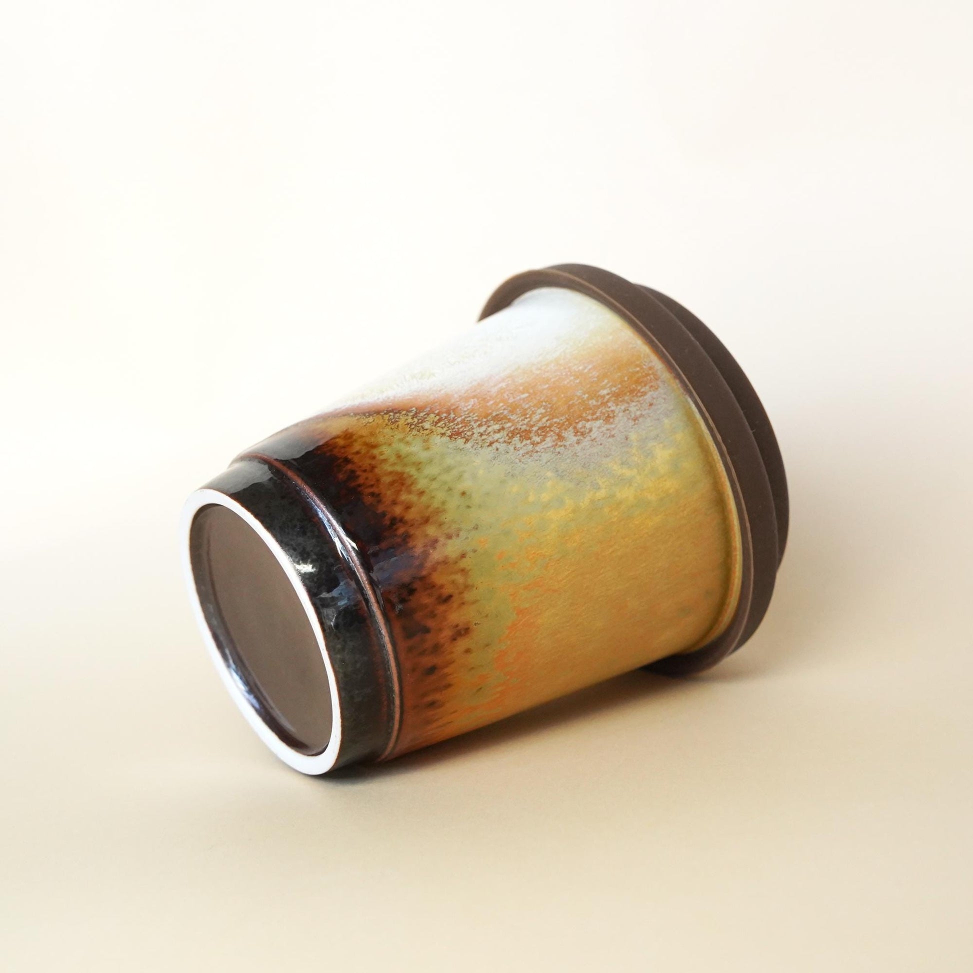 Petite 9oz chocolate ceramic cup with white lid - Slim design for petite hands, fits small purses.