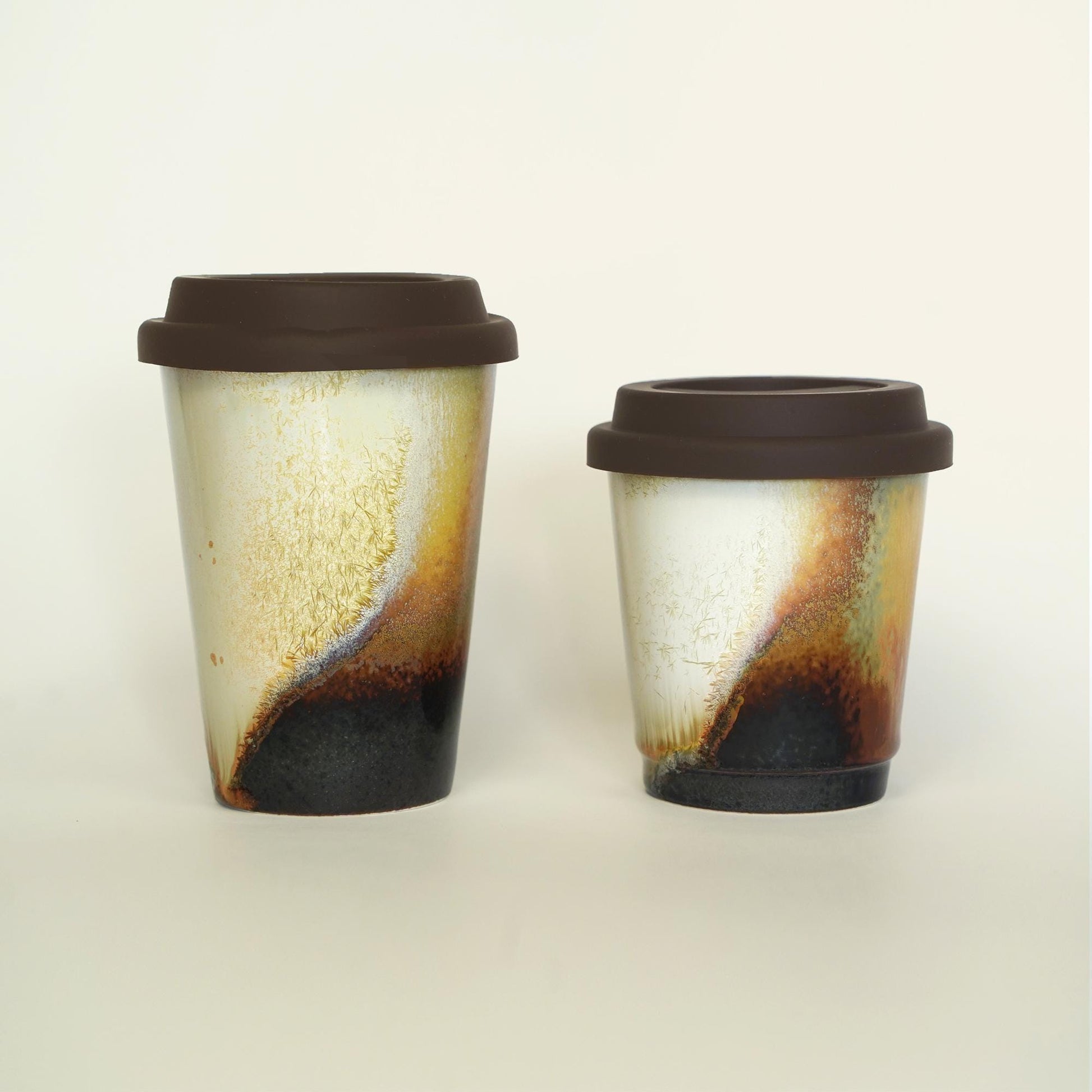 9oz and 11oz ceramic travel mugs side by side - Choose ideal capacity for short trips or long drives. All with silicone lids